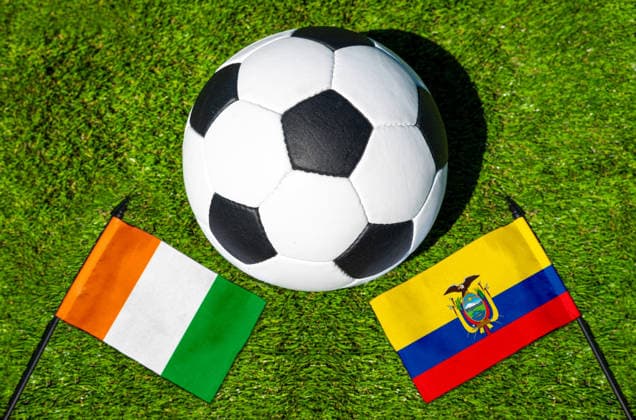 May 22, 2026: PHOTO MONTAGE, 2026 FIFA World Cup, WM, Weltmeisterschaft, Fussball National flags of Ivory Coast and Ecuador with a soccer ball on the field. Stock image for the group stage match on June 15 at the 2026 FIFA World Cup