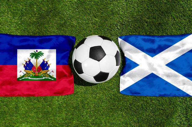 May 22, 2026: PHOTO MONTAGE, 2026 FIFA World Cup, WM, Weltmeisterschaft, Fussball National flags of Haiti and Scotland with a soccer ball on the field. Stock image for the group stage match on June 14 at the 2026 FIFA World Cup