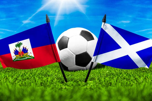 May 22, 2026: PHOTO MONTAGE, 2026 FIFA World Cup, WM, Weltmeisterschaft, Fussball National flags of Haiti and Scotland with a soccer ball on the field. Stock image for the group stage match on June 14 at the 2026 FIFA World Cup