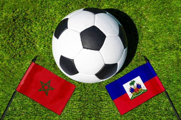 May 22, 2026: PHOTO MONTAGE, 2026 FIFA World Cup, WM, Weltmeisterschaft, Fussball National flags of Morocco and Haiti with a soccer ball on the field. Stock image for the group stage match on June 25 at the 2026 FIFA World Cup
