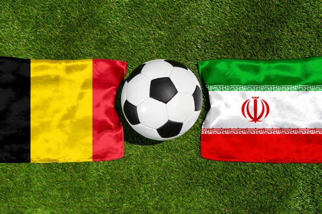 May 22, 2026: PHOTO MONTAGE, 2026 FIFA World Cup, WM, Weltmeisterschaft, Fussball National flags of Belgium and Iran with a soccer ball on the field. Illustrative image for the group stage match on June 21 at the 2026 FIFA World Cup