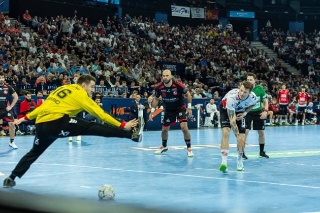 Emil Jakobsen (SG Flensburg-Handewitt) controls the ball during the handball semi-final of the the Winamax EHF Finals 2026 between MT Melsungen and SG Flensburg-Handewitt at Barclays Arena on May 30, 2026 in Hamburg, Germany. -