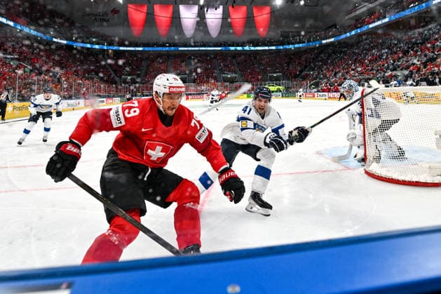 ZURICH, SWITZERLAND - MAY 31: Calvin Thurkauf of Switzerland and Ville Heinola of Finland in a battle along the boards during the 2026 IIHF Ice hockey, Eishockey World Championship, WM, Weltmeisterschaft Switzerland Gold Medal game between Switzerland and Finland at Swiss Life Arena on May 31, 2026 in Zurich, Zurich. Zurich Swiss Life Arena Zurich Switzerland Copyright: xJustPictures.ch AndreaxBrancax jp-en-EuSpIm-JP7_ANB_SuiFin_31052026_9840