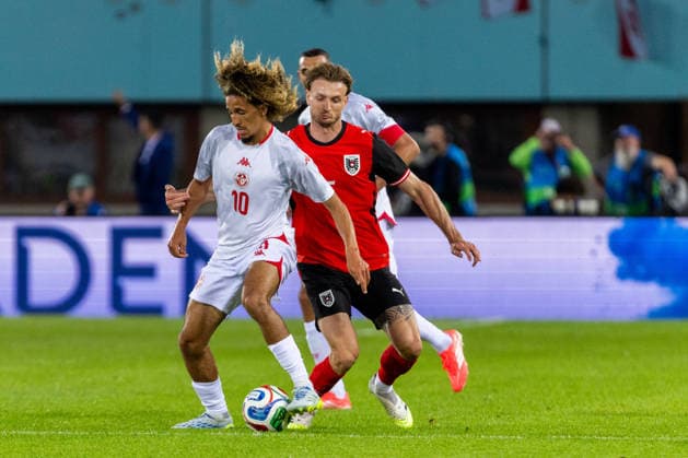 SOCCER - AUT vs TUN, test match VIENNA,AUSTRIA,01.JUN.26 - SOCCER - OEFB international test match, Austria vs Tunisia. Image shows Hannibal Mejbri (TUN) and Stefan Posch (AUT).  GEPAxpictures xPhilippxBrem