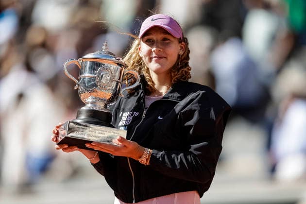 Paris, France - June 6: Mirra Andreeva celebrates with the winner™s trophy after winning her match against Maja Chwalinska of Poland during the Women™s Final on Day Fourteen of the 2026 French Open at Roland Garros on June 6, 2026 in Paris, France. (Photo by JustPictures) Paris Roland Garros France
