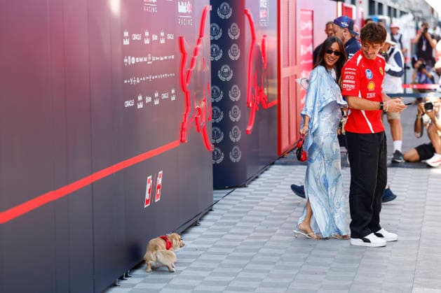 Budapest: F1 GP Hungary 2026 on July, 24, 2026, (Photo by Hoch Zwei), 16 LECLERC Charles (mco), Scuderia Ferrari mit Frau Alexandra Leclerc (Alexandra Saint Mleux) und Hund der vor der Red Bull Garage sein Geschäft macht, wife dog, Budapest Hungary