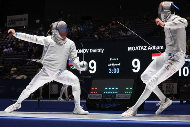 CHINA, HONG KONG - JULY 30, 2026: Athletes Dmitry Nasonov (L) of Russia and Adham Moataz of Egypt fight in their team sabre bout during the 2026 Kerry Fencing World Championships. Mikhail Sinitsyn TASS  95619066