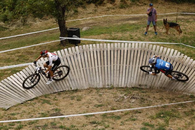 31.07.2026, Monteceneri, Monte Ceneri, 2026 UEC MTB European Championship, EM, Europameisterschaft XCR Team Relay s Final (cross country team relay) Nicolas Halter 2A (SUI, U23 Men) and Filippo Fontana 1A (ITA, Elite Men) in front of the race Monteceneri Monte Ceneri Ticino Switzerland Copyright: xJustPictures.ch FrancescoxMinghettix jp-en-FrMi-_NG_0023