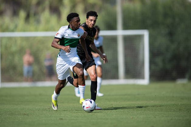 Buba Sangare of Elche and Adnane Ghailan of Cordoba during preseason friendly match between Elche CF v Cordoba CF played at Oliva, Valencia on July 31, 2026 in Spain Oliva Valenci Spain Copyright: xVicentexVidalx xAgenciaxLOFx