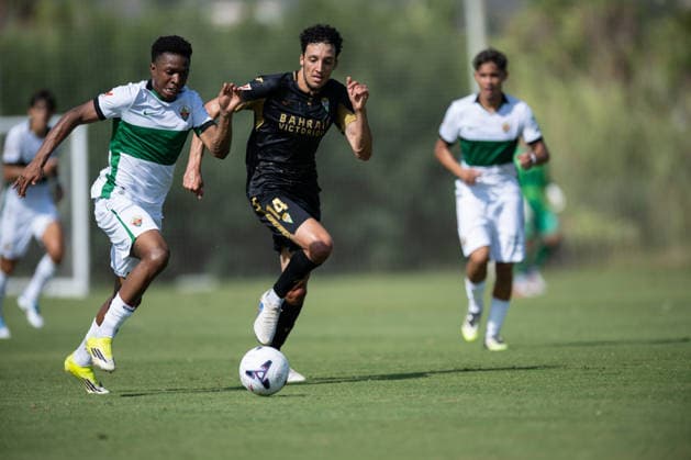 Buba Sangare of Elche and Adnane Ghailan of Cordoba during preseason friendly match between Elche CF v Cordoba CF played at Oliva, Valencia on July 31, 2026 in Spain Oliva Valenci Spain Copyright: xVicentexVidalx xAgenciaxLOFx