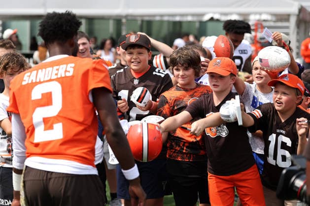 Young Cleveland Browns fans react as Shedeur Sanders (2) approaches to signs autographs after training camp in Berea, Ohio on Friday July 31, 2026.  CLE20260731103a AARONxJOSEFCZYK