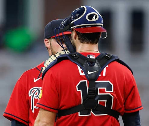 Pitcher Bryce Elder 55 of the Atlanta Braves talks to catcher Joey Bart 16 in the sixth inning against the Washington Nationals at Truist Park on Friday, July 31, 2026 in Atlanta, Georgia.  ATL20260731117 MikexZarrilli