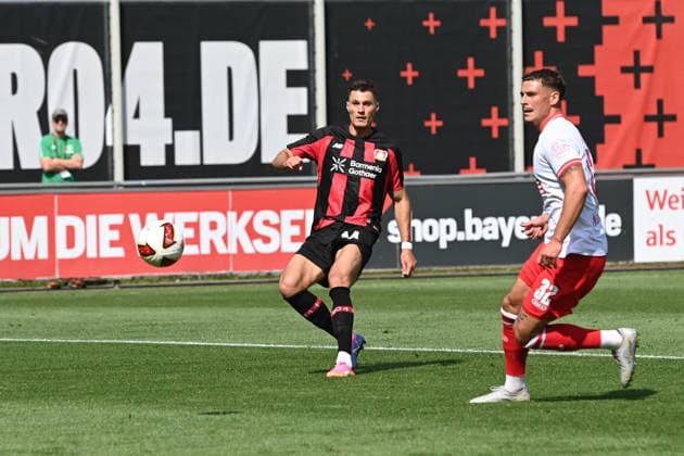 Patrik SCHICK (LEV) Pfostenschuss, Aktion, Zweikampf, gegen Luca BAZZOLI (RWE) Fussball 1. Bundesliga, Testspiel, testmatch, friendly match, Freundschaftsspiel, Bayer Leverkusen (LEV) - Rot Weiss Essen am 01.08.2026 in Leverkusen Deutschland. DFL regulations prohibit any use of photographs as image sequences and or quasi-video Â