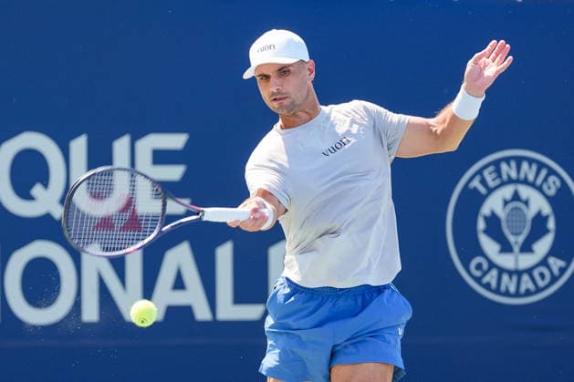 MONTREAL, QC - AUGUST 04: Marcos Giron (USA) returns the ball during a first round match at National Bank Open on August 04, 2026 at IGA Stadium in Montreal, QC (Photo by David Kirouac Icon Sportswire) TENNIS: AUG 04 National Bank Open EDITORIAL USE ONLY Icon26080402026