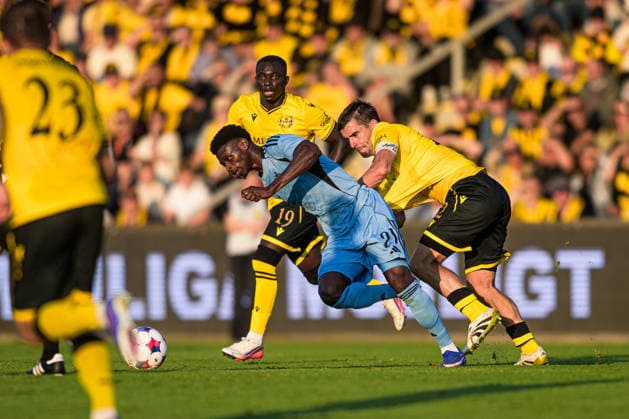 260804 Suleiman Camara Sanneh of Slovan Bratislava and Jesper Gustavsson of Mjällby during the Champions League football qualifying match between Mjällby and Slovan Bratislava on August 4, 2026 in Hällevik. Photo: Christoffer Borg Mattisson BILDBYRAN COP 261 CB0545 fotboll football soccer fotball uefa champions league champions league mjällby slovan bratislava bbeng Copyright: CHRISTOFFERxBORGxMATTISSON BB260804CB112