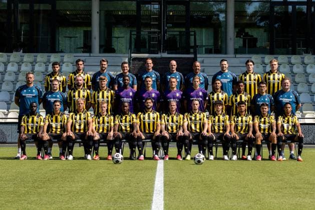 ARNHEM , 04-08-2026 , Nationaal Sportcentrum Papendal , season 2026 2027 , Dutch Keuken Kampioen Divisie football , Photocall , picture shows Vitesse squad with, back row L-R, Vitesse player Ayman Sellouf, Vitesse player Omar Achouitar, Vitesse performance coach Lars Smeenk, Vitesse assistant coach Timm Fahrion, Vitesse head coach Rudiger Rehm, Vitesse assistant coach Mike van Dijk, Vitesse goalkeeper coach Rein Baart, Vitesse physiotherapist Tijmen Gores, Vitesse player Koen te Veluwe, Vitesse player Eduard Probst, middle row L-R, Vitesse team manager Erwin Mulder, Vitesse kit manager Fabian van Drumpt, Vitesse player Valon Zumberi, Vitesse player Marcus Steffen, Vitesse goalkeeper Tyrick Bodak, Vitesse goalkeeper Connor van den Berg, Vitesse goalkeeper Maximilian Brull, Vitesse goalkeeper Jayden Siecker, Vitesse player Naoufal Bannis, Vitesse player Nathan Markelo, Vitesse video analyst Yuhao Zhang, Vitesse kit manager Leon Keijman, front row L-R, Vitesse player Solomon Bonnah, Vitesse player Youssef Ouallil, Vitesse player Chiel Olde Keizer, Vitesse player Mathijs Marschalk, Vitesse player Joao Pinto, Vitesse player Marco Schikora, Vitesse player Alexander Buttner, Vitesse player Nino Zonneveld, Vitesse player Yuval Ranon, Vitesse player Ricardo Schwarz, Vitesse player Filipe de Carvalho and Vitesse player Xiamaro Thenu pose for a teamphoto Photocall Vitesse x205454880x Copyright: