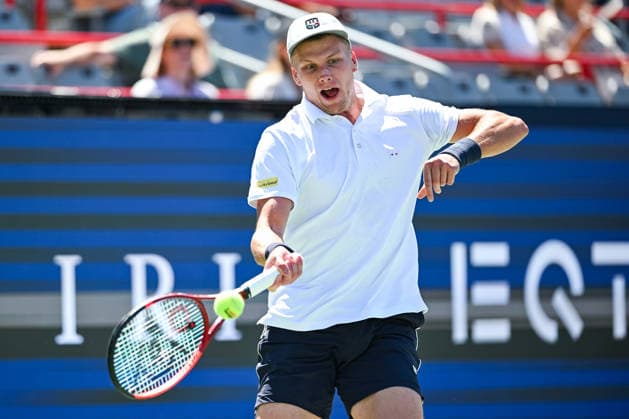 MONTREAL, QC - AUGUST 05: Jenson Brooksby (USA) returns the ball during a second round match at National Bank Open on August 05, 2026 at IGA Stadium in Montreal, QC (Photo by David Kirouac Icon Sportswire) TENNIS: AUG 05 National Bank Open EDITORIAL USE ONLY Icon26080503326