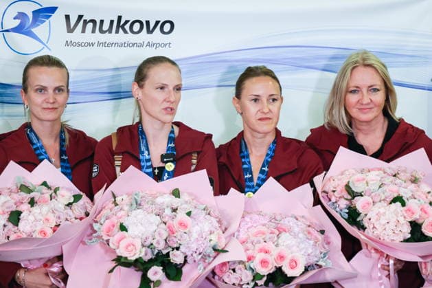 RUSSIA, MOSCOW - AUGUST 7, 2026: Russian national synchronised swimming team head coach Svetlana Romashina (C) and coaches Marina Golyadkina, Daria Alexandrova nad Gana Maksimova (L-R) pose during the Russian national synchronised swimming team’s arrival at Vnukovo Airport. The team returned from France after the 2026 European Aquatics Championships, held in Paris from July 31 to August 16, having won three gold, one silver, and three bronze medals. Russian athletes performed in the event under a neutral status. Vladimir Gerdo TASS  95869797