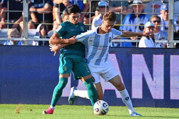 Emre ERDOGAN (1860 Muenchen), Aktion,Zweikampf gegen Aris Isa MALAJ (A), Fussball Regionalliga Bayern Saison 2026 2027,26 27 3.Spieltag TSV 1860 Muenchen - FC Augsburg II am 07.08.2026 in Muenchen GRUENWALDER STADION.