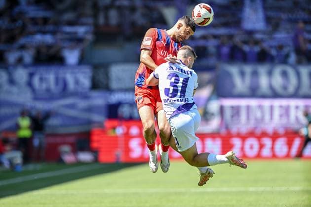 Oualid Mhamdi (1. FC Heidenheim 1846) und Patrick Kammerbauer (VfL Osnabrueck) im Zweikampf waehrend des spiels der 2. Bundesliga zwischen 1. FC Heidenheim und VfL Osnabrueck, Voith-Arena am 08. August 2026 in Heidenheim an der Brenz, Deutschland. (Foto von Harry Langer DeFodi Images) +++ Oualid Mhamdi (1. FC Heidenheim 1846) und Patrick Kammerbauer (VfL Osnabrueck) battle for the ball during the 2nd Bundesliga match between 1. FC Heidenheim and VfL Osnabrueck at Voith-Arena on August 8, 2026 in Heidenheim an der Brenz, Germany. (Photo by Harry Langer DeFodi Images) DFB DFL REGULATIONS PROHIBIT ANY USE OF PHOTOGRAPHS AS IMAGE SEQUENCES AND OR QUASI-VIDEO. (Photo by Harry Langer DeFodi Images) DFB DFL REGULATIONS PROHIBIT ANY USE OF PHOTOGRAPHS AS IMAGE SEQUENCES AND OR QUASI-VIDEO. -