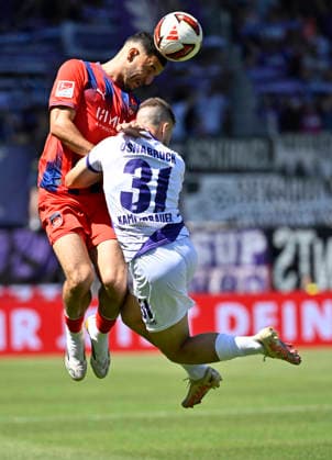 Kopfballduell Zweikampf Aktion Patrick Kammerbauer VfL Osnabrueck (31) gegen Marcel Costly 1. FC Heidenheim 1846 FCH (24) 1. FC Heidenheim 1846 FCH vs VfL Osnabrueck 08.08.2026 DFL REGULATIONS PROHIBIT ANY USE OF PHOTOGRAPHS AS IMAGE SEQUENCES AND OR QUASI-VIDEO 1. FC Heidenheim 1846 FCH vs VfL Osnabrueck
