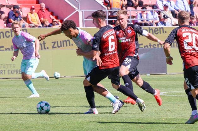 Ohne Not bringen Simon Lorenz (FC Ingolstadt 04, Nr.32) und Georgios Antzoulas (FC Ingolstadt 04, Nr.6) Namrud Embaye (Wuerzburger Kickers, Nr.6) zu Fall beim Spiel FC Ingolstadt 04 gegen Wuerzburger Kickers am 08.08.2026, DFB regulations prohibit any use of photographs as image sequences and or quasi-video. GER, Fussball, 3. Liga, Spieltag 1, FC Ingolstadt 04 gegen Wuerzburger Kickers, 08.08.2026, Audi Sportpark Ingolstadt Copyright: xEibner-Pressefoto OliverxSTRISCHx EP-OSH