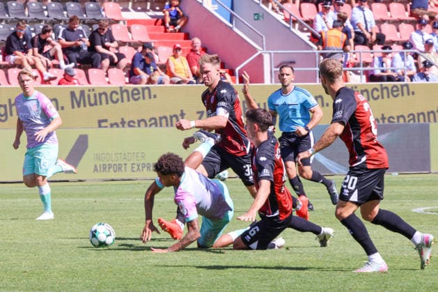 Ohne Not bringen Simon Lorenz (FC Ingolstadt 04, Nr.32) und Georgios Antzoulas (FC Ingolstadt 04, Nr.6) Namrud Embaye (Wuerzburger Kickers, Nr.6) zu Fall beim Spiel FC Ingolstadt 04 gegen Wuerzburger Kickers am 08.08.2026, DFB regulations prohibit any use of photographs as image sequences and or quasi-video. GER, Fussball, 3. Liga, Spieltag 1, FC Ingolstadt 04 gegen Wuerzburger Kickers, 08.08.2026, Audi Sportpark Ingolstadt Copyright: xEibner-Pressefoto OliverxSTRISCHx EP-OSH