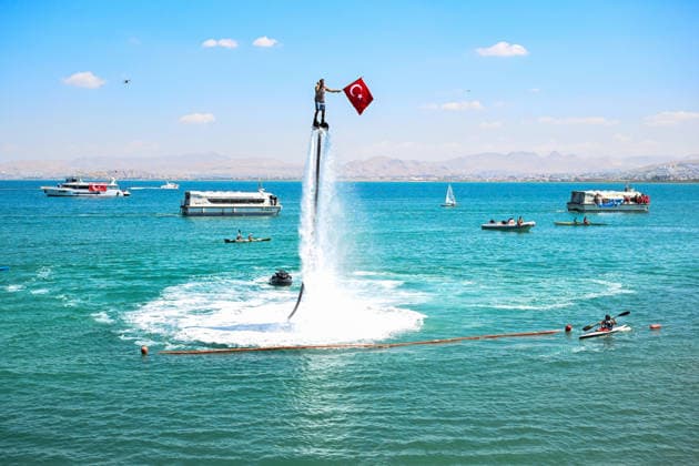 12th Van Sea Water Sports Festival kicks off on Lake Van VAN, TURKIYE - AUGUST 08: A view of participants and athletes taking part in the 12th Van Sea Water Sports Festival held at the Edremit-Gebze Water Sports Center on the shores of Lake Van in Van, Turkiye, on August 08, 2026. Organized to promote Lake Van and boost local tourism, the two-day event features Beach volleyball, Beachvolleyball and handball matches, flyboard demonstrations, canoeing, rowing, dragon boat races, and various recreational activities. Ozkan Bilgin Anadolu Van Turkey. Editorial use only. Please get in touch for any other usage. Copyright: x2026xAnadoluxOzkanxBilginx