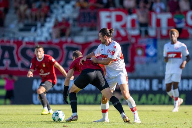 Fabian Eisele (SG Sonnenhof Großaspach, 23) im Zweikampf mit David Haider (Fortuna Köln, 15), SG Sonnenhof Großaspach vs. Fortuna Köln, Fussball, 3. Liga, 1. Spieltag, 08.08.2026, DFB regulations prohibit any use of photographs as image sequences and or quasi-video Aspach Baden-Wuerttemberg Deutschland