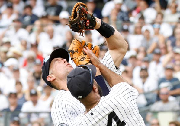 New York Yankees Paul Goldschmidt and Amed Rosario collide in the infield while both fielding a pop up in the 3rd inning against the Atlanta Braves at Yankee Stadium on Saturday, August 8, 2026 in New York City.  NYP20260808114 JOHNxANGELILLO