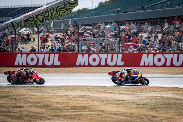 RECORD DATE NOT STATED 9th August 2026; Silverstone Circuit, Northamptonshire, England; 2026 MotoGP Grand Prix of Great Britain, Race Day; Filip Salac of the OnlyFans American Racing Team celebrates winning the Qatar Airways British Grand Prix Moto2 race with Ivan Ortola of the QJMotor El Motorista MSI team in second GodfreyxPitt