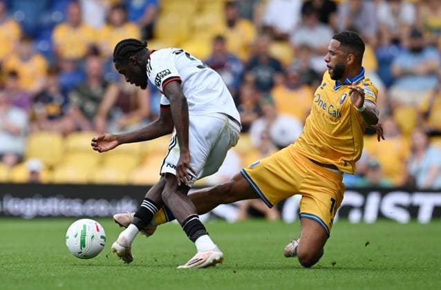 Femi Seriki of Sheffield United is tackled by Tyler Roberts of Mansfield Town Mansfield Town v Sheffield United, EFL Carabao Cup, First Round, Football, One Call Stadium, Mansfield, UK - 09 Aug 2026Mansfield One Call Stadium United Kingdom EDITORIAL USE ONLY No use with unauthorised audio, video, data, fixture lists, club league logos or live services. Online in-match use limited to 120 images, no video emulation. No use in betting, games or single club league player publications.  Copyright: xAnnaxGowthorpe Shutterstockx 17051191ag