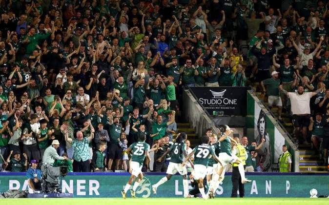 Plymouth Argyle fans celebrate the opening goal scored by Alex Hartridge Plymouth Argyle v Exeter City, EFL Carabao Cup, First Round, Football, Home Park, Plymouth, UK - 10 Aug 2026Plymouth Home Park United Kingdom EDITORIAL USE ONLY No use with unauthorised audio, video, data, fixture lists, club league logos or live services. Online in-match use limited to 120 images, no video emulation. No use in betting, games or single club league player publications. Copyright: xKieranxMcManus Shutterstockx 17061087by