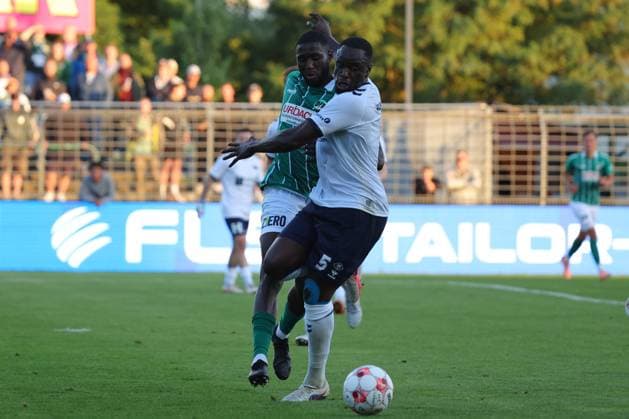 11.08.26, GER, Regionalliga Nord, Fussball, 1. Spieltag, Saison 2026 2027, Dietmar-Scholze-Stadion an der Lohmuehle, VfB Lübeck vs VfB Oldenburg Daouda Beleme (VfB Luebeck 21) im Zweikampf gegen Anouar Adam (VfB Oldenburg 05) Foto nordphoto GmbH Tauchnitz Luebeck Dietmar-Scholze-Stadion an der Lohmuehle SH Germany Copyright: xnordphotoxGmbHx xTauchnitzx