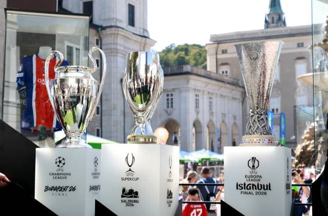 Fans pose for photos in the Super Cup fanzone next to the Super Cup, Champions League and Europa League trophies. Paris St Germain v Aston Villa, UEFA Super Cup Final, Football, Red Bull Arena, Salzburg, Austria - 12 Aug 2026Salzburg Red Bull Arena, Austria  Copyright: xJamesxMarsh Shutterstockx 17064758o