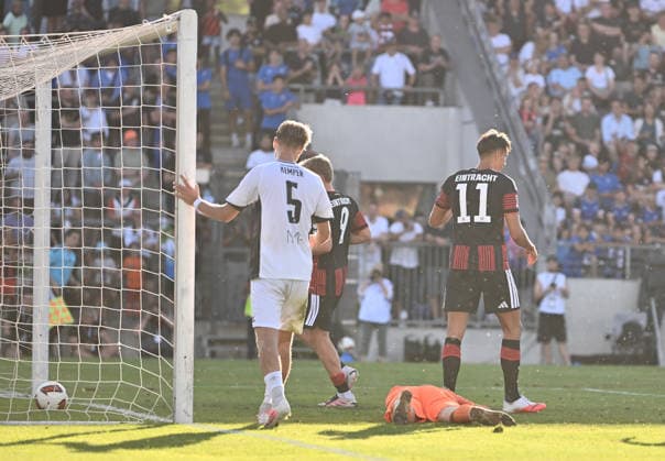 12.08.2026, xfux, Fussball Testspiel, FSV Frankfurt - Eintracht Frankfurt, v.l. Lucas Becker (FSV Frankfurt), Younes Ebnoutalib (Eintracht Frankfurt) Goal scored, Tor zum 0:2 (DFL DFB REGULATIONS PROHIBIT ANY USE OF PHOTOGRAPHS as IMAGE SEQUENCES and or QUASI-VIDEO) Frankfurt am Main
