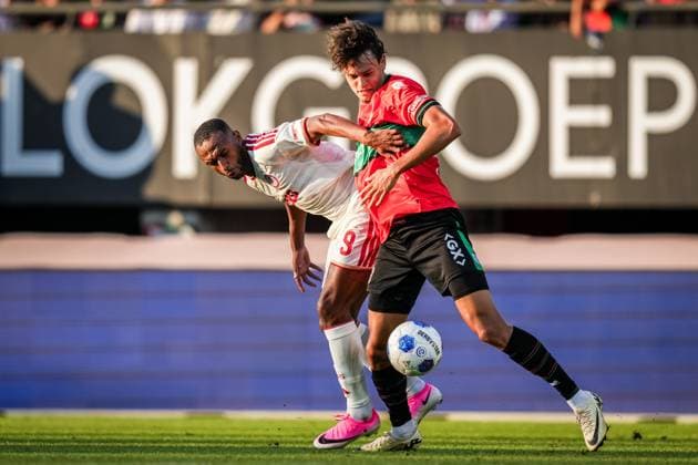 NIJMEGEN , 08-07-2026 , Stadium De Goffert , season 2026 2027 , Third qualifying round UEFA Champions League 2nd leg football , match between NEC Nijmegen and Olympiacos , picture shows NEC Nijmegen player Tobias Storm and Olympiacos player Ayoub El Kaabi NEC - Olympiacos  x205660678x Copyright:
