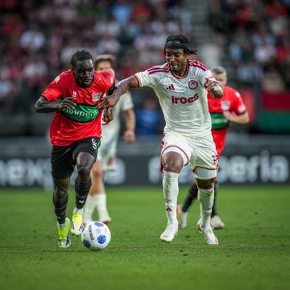 NIJMEGEN , 08-07-2026 , Stadium De Goffert , season 2026 2027 , Third qualifying round UEFA Champions League 2nd leg football , match between NEC Nijmegen and Olympiacos , picture shows NEC Nijmegen player Brayann Pereira and Olympiacos player Bruno Onyemaechi NEC - Olympiacos  x205660684x Copyright: