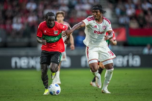 NIJMEGEN , 08-07-2026 , Stadium De Goffert , season 2026 2027 , Third qualifying round UEFA Champions League 2nd leg football , match between NEC Nijmegen and Olympiacos , picture shows NEC Nijmegen player Brayann Pereira and Olympiacos player Bruno Onyemaechi NEC - Olympiacos  x205660686x Copyright: