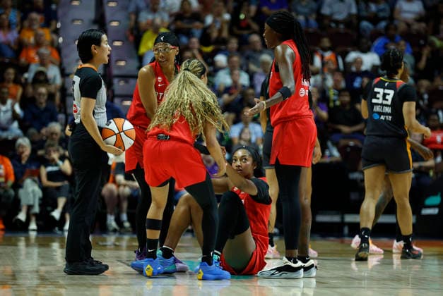 UNCASVILLE, CT - AUGUST 13: Allisha Gray 15 of the Atlanta Dream, Jordin Canada 3 of the Atlanta Dream and Rhyne Howard 10 of the Atlanta Dream assist Angel Reese 5 of the Atlanta Dream during the WNBA, Basketball Damen, USA game between Atlanta Dream and Connecticut Sun on August 13, 2026, at Mohegan Sun Arena in Uncasville, CT. (Photo by M. Anthony Nesmith Icon Sportswire) WNBA: AUG 13 Atlanta Dream at Connecticut Sun EDITORIAL USE ONLY Icon26081362