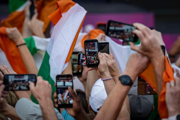 RECORD DATE NOT STATED 14th August 2026; Alexander Stadium, Birmingham, Midlands, England; 2026 European Athletics Championships, Day Five; Republic of Ireland fans record the ceremony on their phones as Mark English (IRL) collects his gold medal in the mens 800m GodfreyxPitt