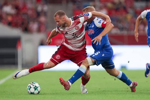 Eric Hottmann (Fortuna Duesseldorf) und Valentin Laessig (TSG Hoffenheim II) im Zweikampf waehrend des Spiels der 3. Liga zwischen Fortuna Duesseldorf und TSG 1899 Hoffenheim II, Merkur Spiel-Arena am 15. August 2026 in Duesseldorf, Deutschland. (Foto von Oliver Kaelke DeFodi Images) +++ Eric Hottmann (Fortuna Duesseldorf) und Valentin Laessig (TSG Hoffenheim II) battle for the ball during the 3. Liga match between Fortuna Duesseldorf and TSG 1899 Hoffenheim II at Merkur Spiel-Arena on August 15, 2026 in Dusseldorf, Germany. (Photo by Oliver Kaelke DeFodi Images) DFB DFL REGULATIONS PROHIBIT ANY USE OF PHOTOGRAPHS AS IMAGE SEQUENCES AND OR QUASI-VIDEO. (Photo by Oliver Kaelke DeFodi Images) -