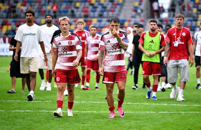 Düsseldorf, Germany, 3. Liga, Matchday 2, Merkur-Spiel-Arena Düsseldorf, Fortuna Düsseldorf vs TSG Hoffenheim II 0:2; Matthias Zimmermann (F95) and Sascha Risch (F95) after the match. Disappointment, Frustration, Action.