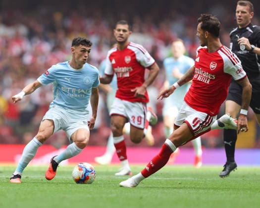 Arsenal v Manchester City FA Community Shield Phil Foden of Manchester City attacks wit pressure from Ben White of Arsenal during the FA Community Shield match between Arsenal and Manchester City at the Principality Stadium, Cardiff 16 08 2026 UK Newspapers OUT Copyright: xKaraxThomasx FIL-23790-0021