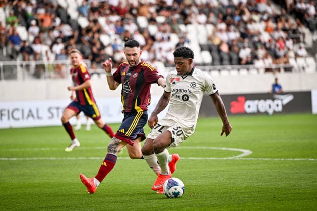 LUGANO, SWITZERLAND - AUGUST 16: Dereck Moncada of Lugano protects the ball from Dusan Cvetkovic of Vedeggio during the Swiss Cup match between Vedeggio Calcio and FC Lugano at AIL Arena on August 16, 2026 in Lugano, Switzerland. Lugano AIL Arena Ticino Switzerland Copyright: xJustPictures.ch AndreaxBrancax jp-en-EuSpIm-AB_16082026_4675