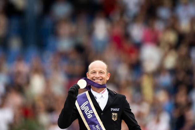 260816 Michael Jung of Germany celebrate on the podium after winning individual gold medal in the Eventing Show Jumping Final during day 6 of the 2026 FEI World Championships on August 16, 2026 in Aachen. Photo: Emma Wallskog BILDBYRAN kod EW EW0687 ridsport equestrian rid-vm 2026 2026 fei world championships bbeng ridsport-vm fälttävlan eventing Copyright: EMMAxWALLSKOG BB260816EW055