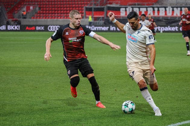 Zweikampf Lars Lokotsch (FC Ingolstadt 04, Nr.13) gegen Klaus Gjasula (TSG Hoffenheim II, Nr.5) beim Spiel FC Ingolstadt 04 gegen TSG Hoffenheim II am 16.09.2026, DFB regulations prohibit any use of photographs as image sequences and or quasi-video. GER, Fussball, 3. Liga, Spieltag 6, FC Ingolstadt 04 gegen TSG Hoffenheim II, 16.09.2026, Audi Sportpark Ingolstadt Copyright: xEibner-Pressefoto OliverxSTRISCHx EP-OSH