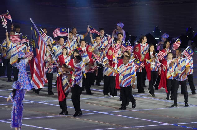 (260919) -- NAGOYA, Sept. 19, 2026 -- The delegation of Malaysia parades into the stadium during the opening ceremony of the 20th Asian Games Aichi-Nagoya 2026 in Nagoya, Japan, Sept. 19, 2026. ) (SP)JAPAN-NAGOYA-ASIAN GAMES-OPENING CEREMONY ZhouxMi 