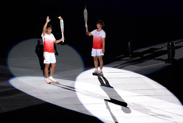 (260919) -- NAGOYA, Sept. 19, 2026 -- Torch bearers Kitajima Kosuke (L) and Fujinami Akari hand over the flame during the opening ceremony of the 20th Asian Games Aichi-Nagoya 2026 in Nagoya, Japan, Sept. 19, 2026. ) (SP)JAPAN-NAGOYA-ASIAN GAMES-OPENING CEREMONY WangxFei 
