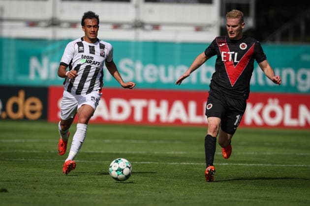 3. Liga - Saison 2026 27 - Victoria Köln - FC Ingolstadt 04 - Nishan Velupillay (Nr.28 - FCI) - Meiko Sponsel (Nr.19 - Viktoria Köln) - Foto: Meyer Jürgen 3. Liga - Saison 2026 27 - Victoria Köln - FC Ingolstadt 04
